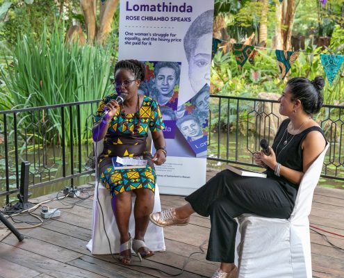 Image of Mona Hakimi, editor of the book 'Lomathinda: Rose Chibambo Speaks' interact with author Timwa Lipenga during the book launch.